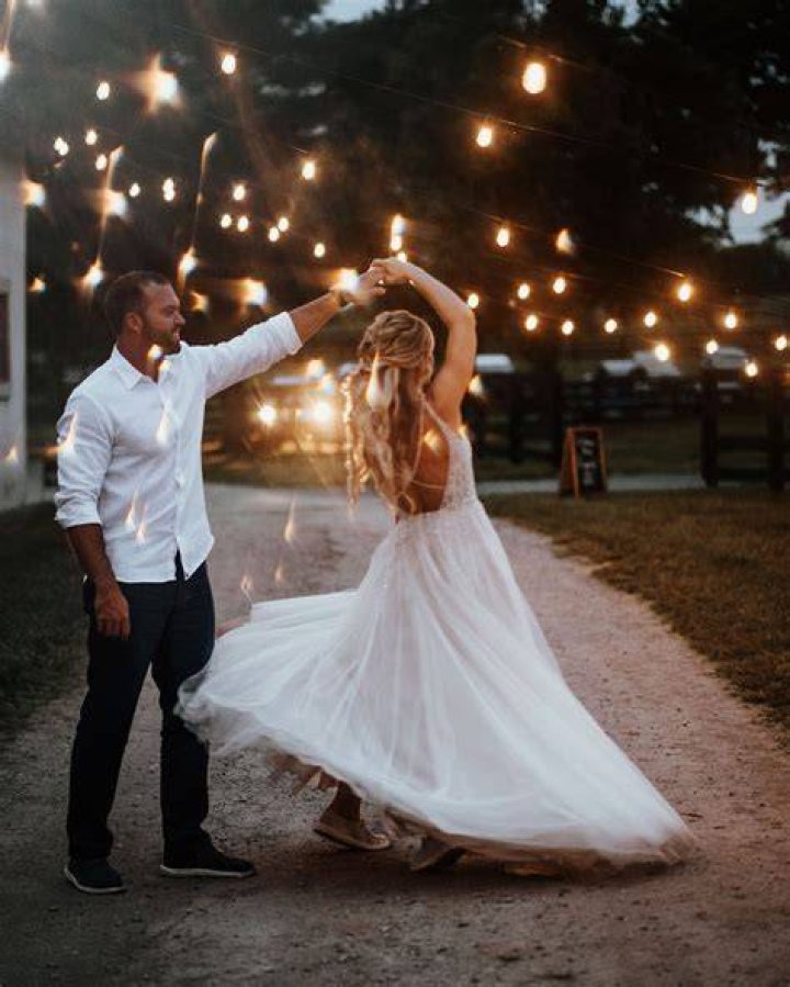 a bride and groom dance together at their wedding reception