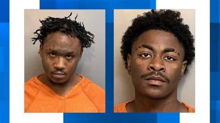 Rhodes is charged with murder in the stabbing deaths of two siblings